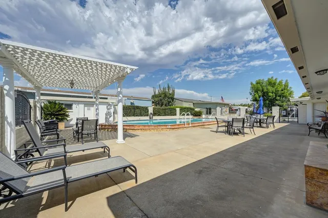 a view of a house with swimming pool