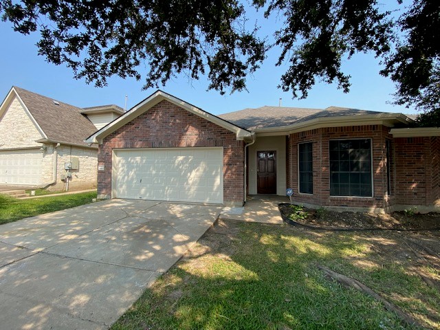 1512 Lorson Loop Round Rock, TX 78665 - Photo 2 of 29 front view of a house with a yard
