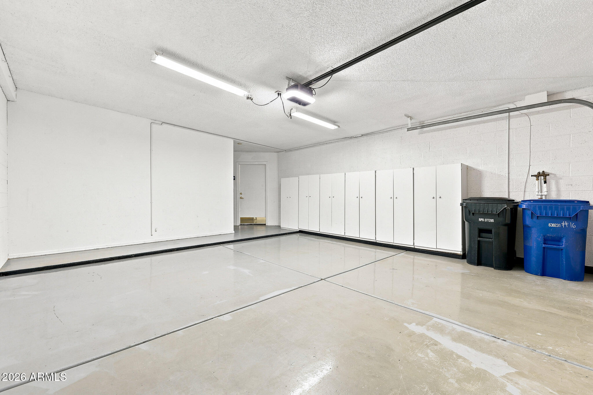 2059 East Brown Road, Unit 16 Mesa, AZ 85213 - Photo 23 of 33 Garage with ample storage