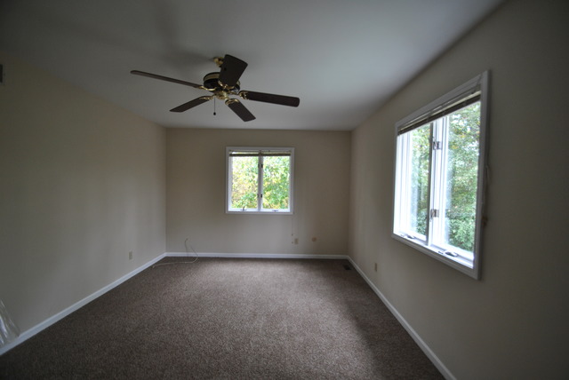 42W734 Kedeka Road Sugar Grove, IL 60554 - Photo 13 of 25 an empty room with windows and fan