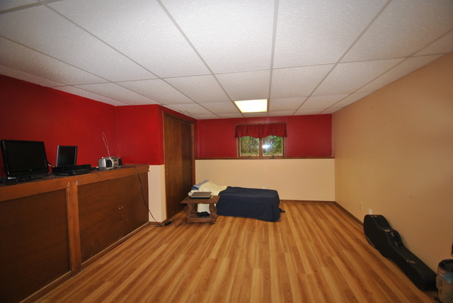 42W734 Kedeka Road Sugar Grove, IL 60554 - Photo 18 of 25 a room with wooden floor and furniture