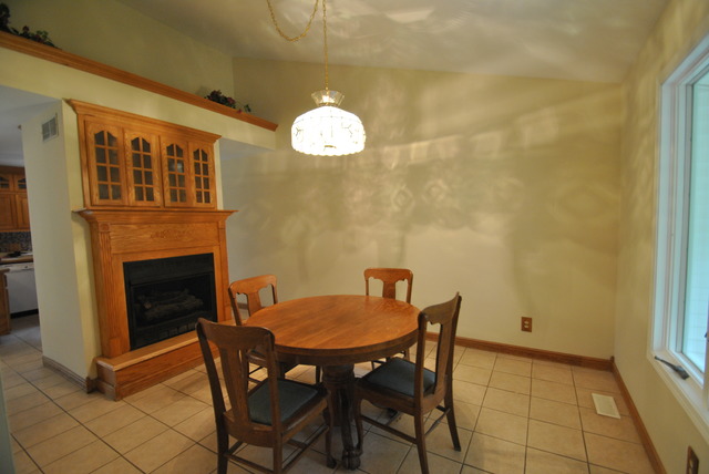 42W734 Kedeka Road Sugar Grove, IL 60554 - Photo 5 of 25 a view of a livingroom with furniture and a fireplace