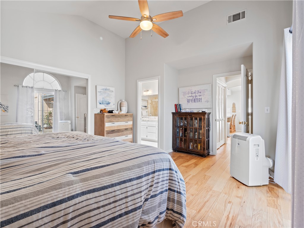 2517 Rockefeller Lane, Unit B Redondo Beach, CA 90278 - Photo 11 of 36 a bedroom with a large bed and a chandelier