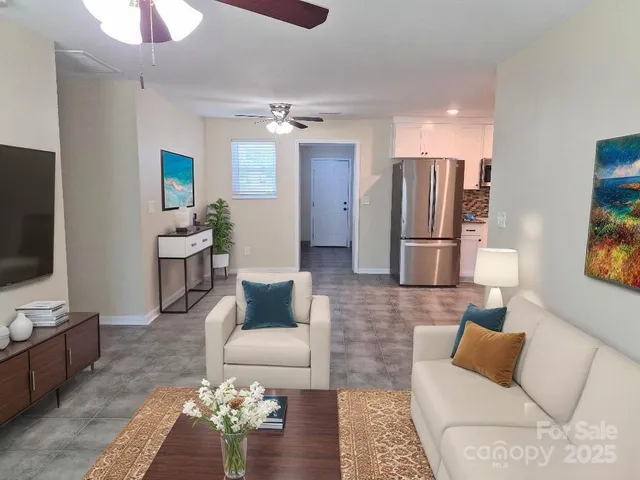 a living room with furniture and a flat screen tv