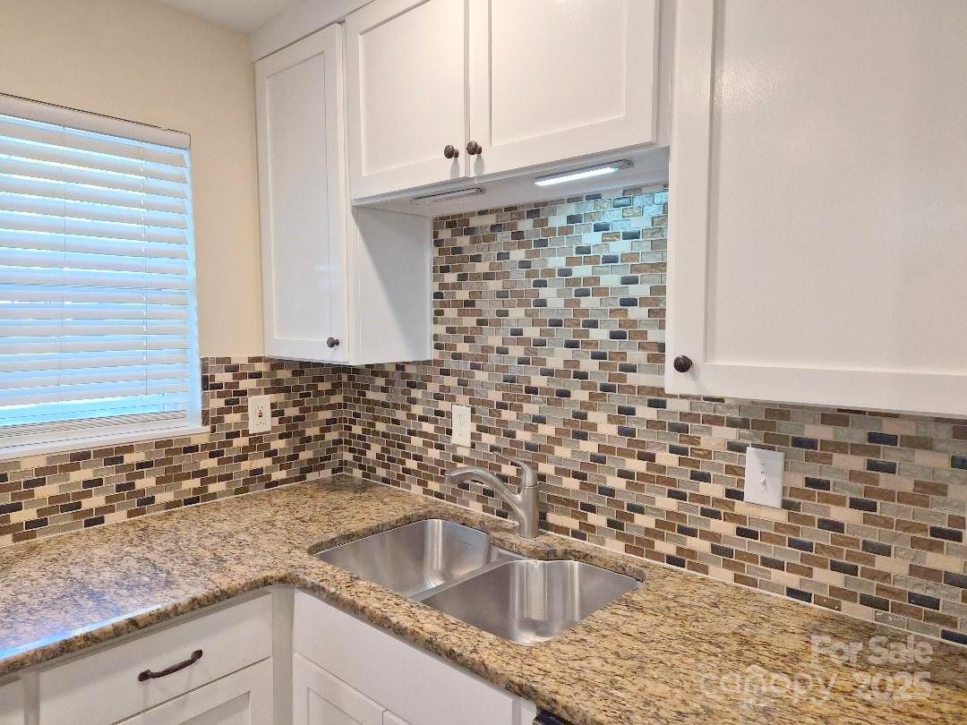 1352 Steed Street Rock Hill, SC 29732 - Photo 5 of 15 a kitchen with granite countertop a sink and a stove