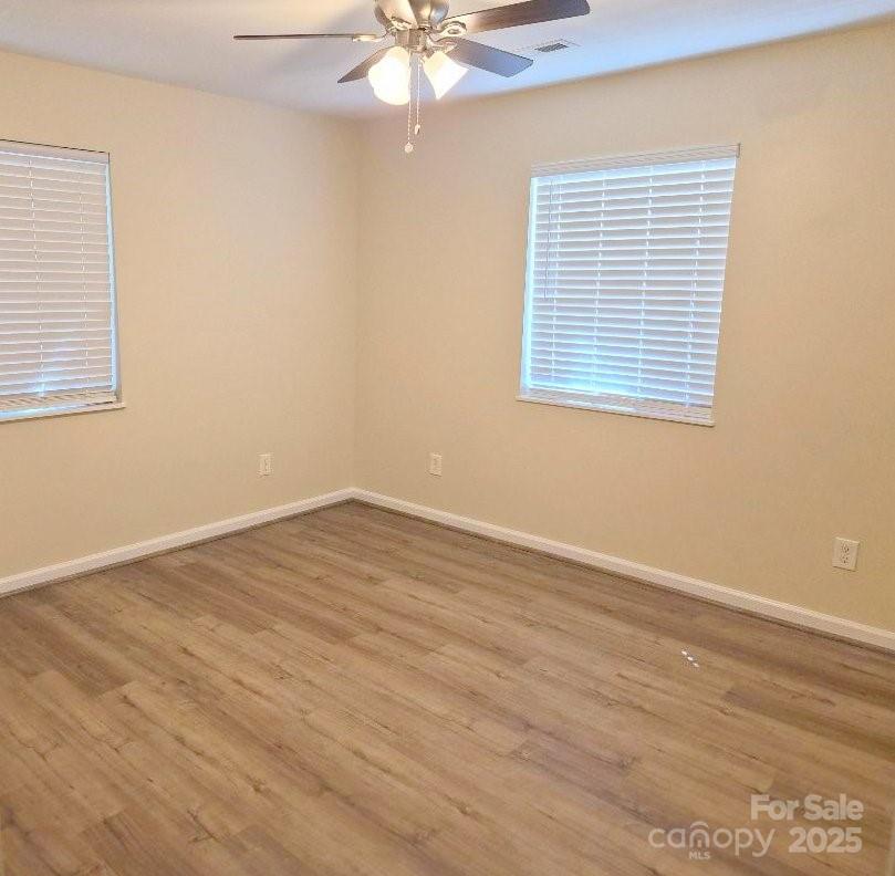 1352 Steed Street Rock Hill, SC 29732 - Photo 7 of 15 a view of an empty room with wooden floor and a window