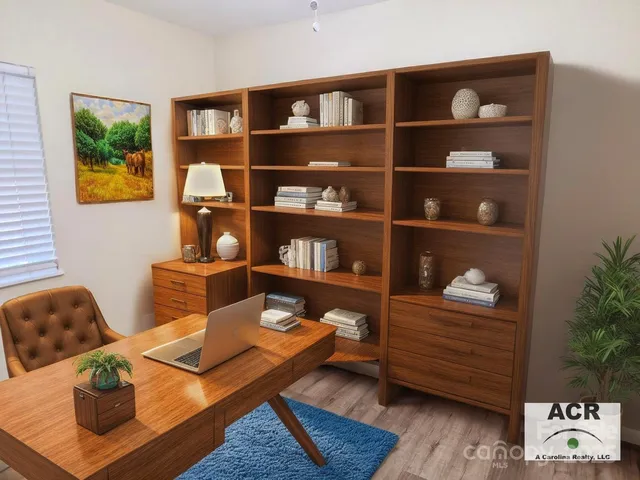 a living room with furniture and book shelf
