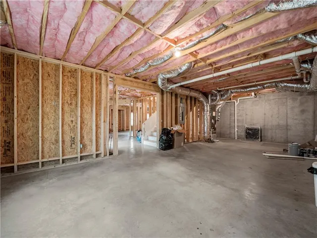 a view of a room with wooden walls