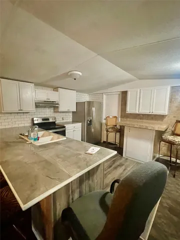 a bed room with a bed and a television