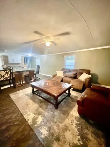 a living room with furniture and a table