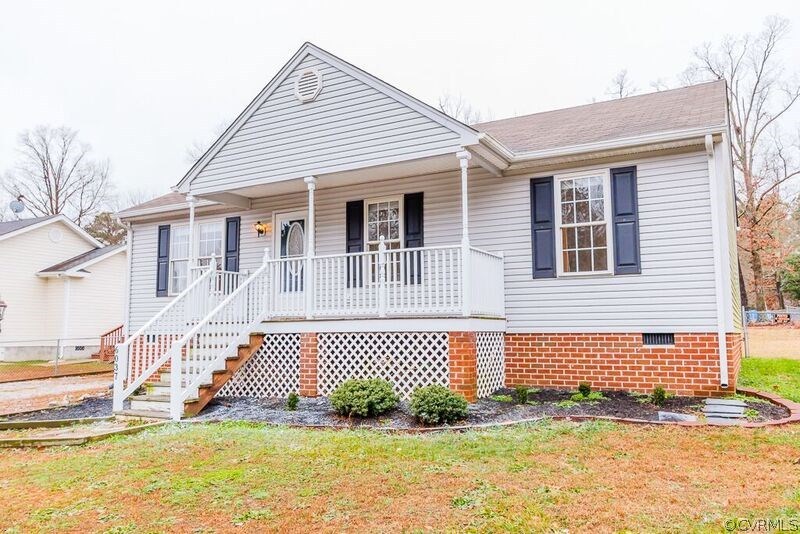 6037 Springbank Road Petersburg, VA 23803 - Photo 1 of 15 a front view of a house with a garage