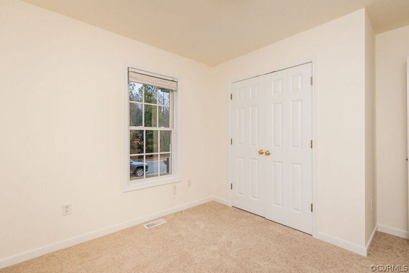 6037 Springbank Road Petersburg, VA 23803 - Photo 11 of 15 a view of an empty room with a window
