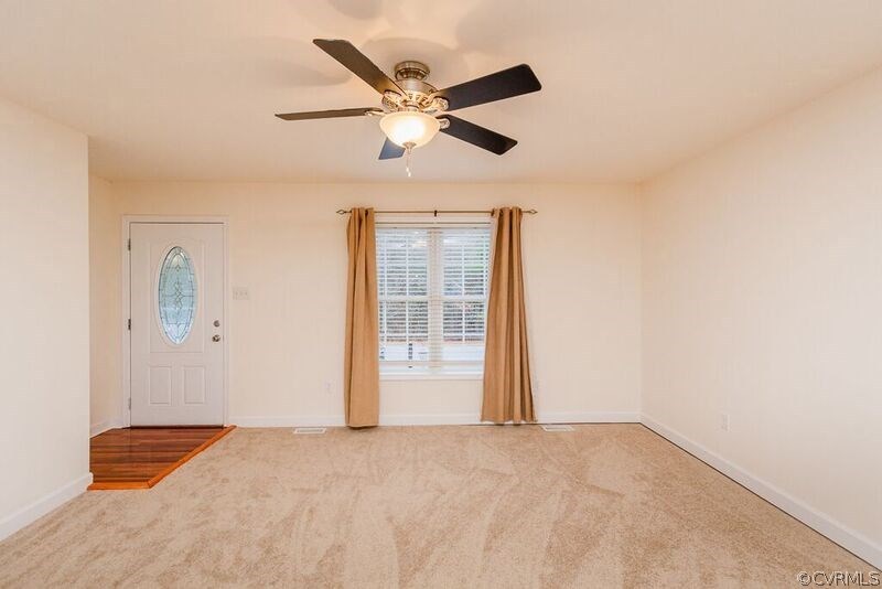 6037 Springbank Road Petersburg, VA 23803 - Photo 2 of 15 a view of an empty room with a ceiling fan