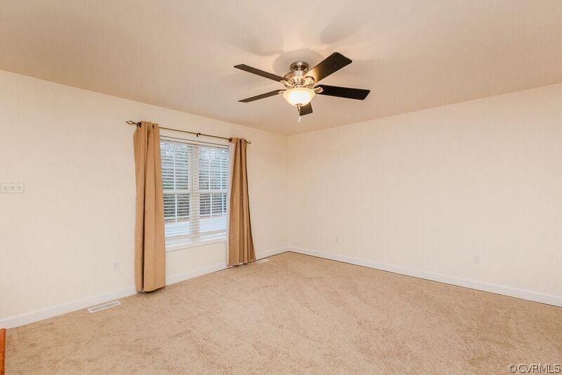 6037 Springbank Road Petersburg, VA 23803 - Photo 4 of 15 a view of an empty room with a window