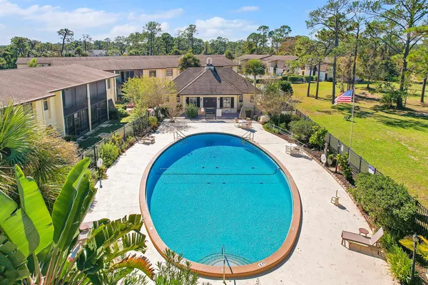 an aerial view of a house with a swimming pool