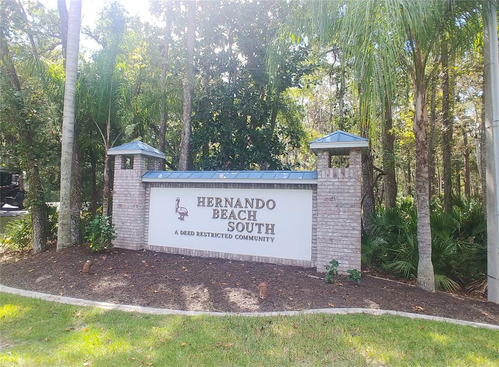 4002 Sheephead Drive Hernando Beach, FL 34607 - Photo 1 of 1 a sign on the side of a road