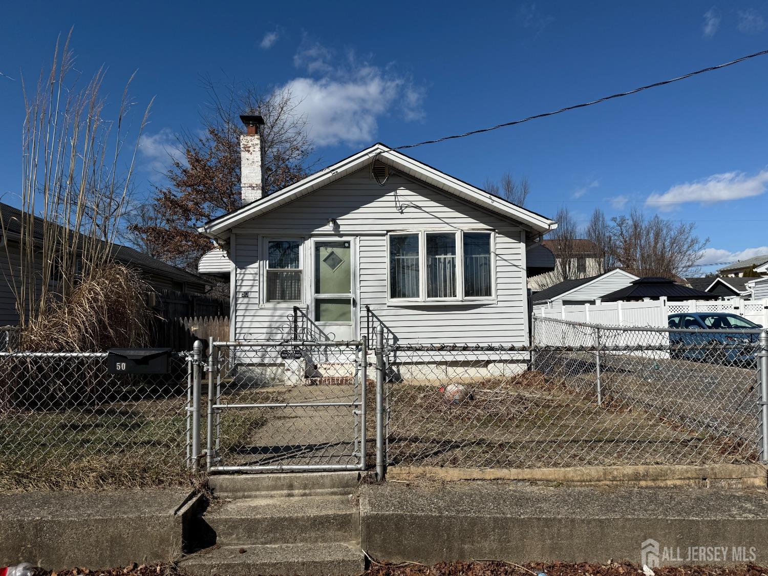 50 Pacific Boulevard Old Bridge, NJ 07735 - Photo 2 of 12 a front view of a house with parking space