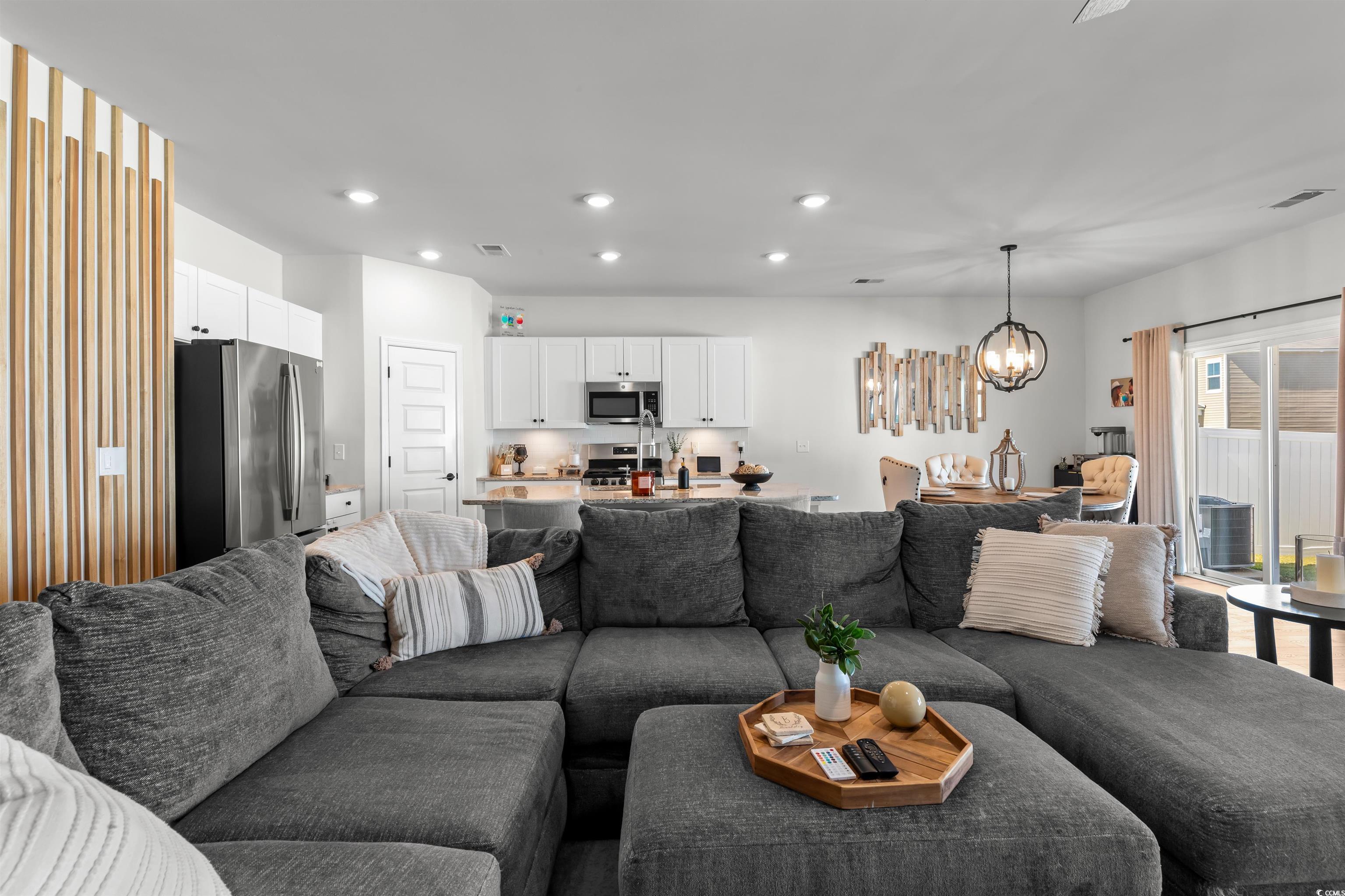 1067 Saltgrass Way Myrtle Beach, SC 29588 - Photo 17 of 40 Living room with recessed lighting and a chandelier