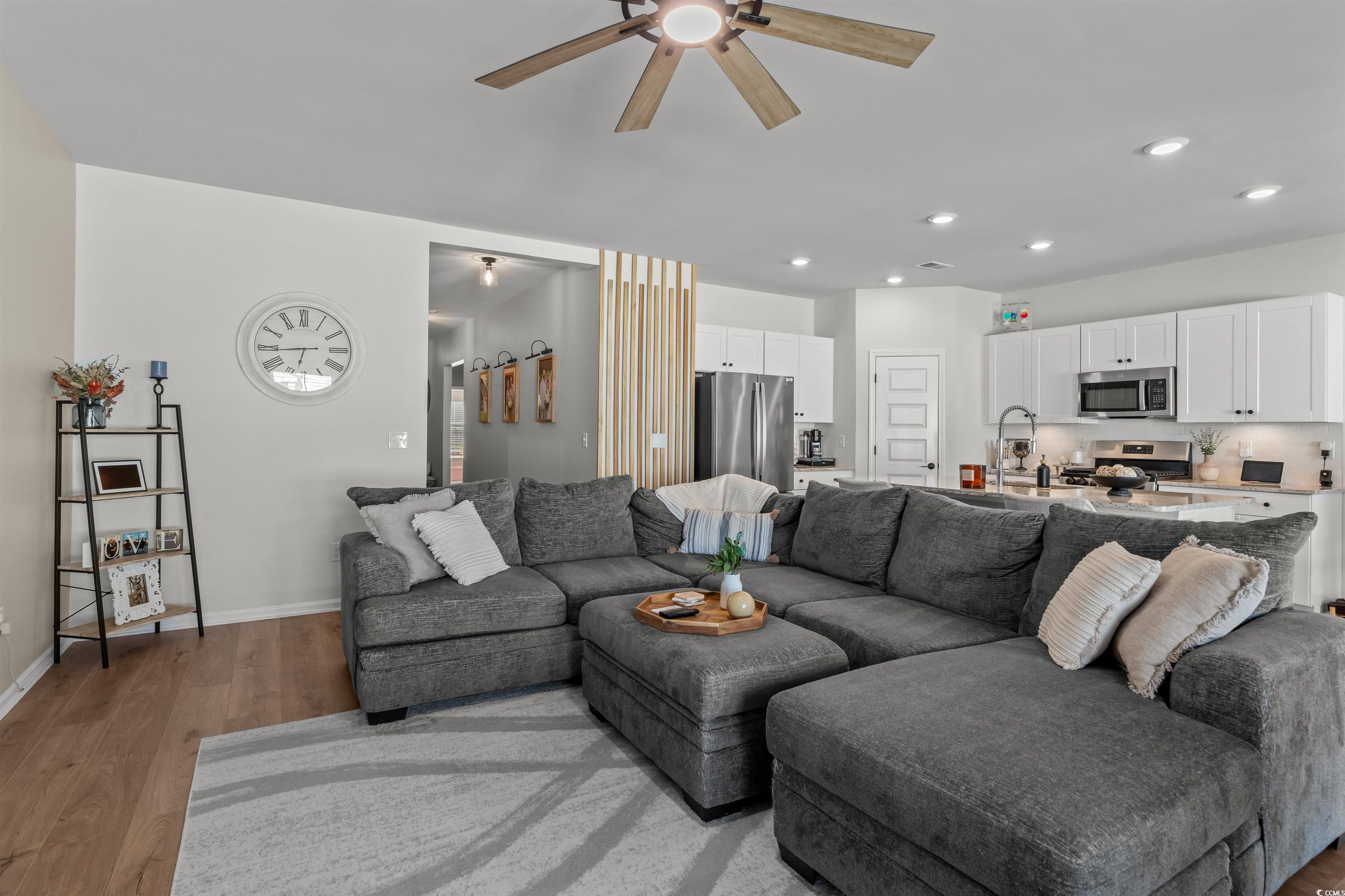 1067 Saltgrass Way Myrtle Beach, SC 29588 - Photo 18 of 40 Living area with light wood-type flooring, recessed lighting, and a ceiling fan