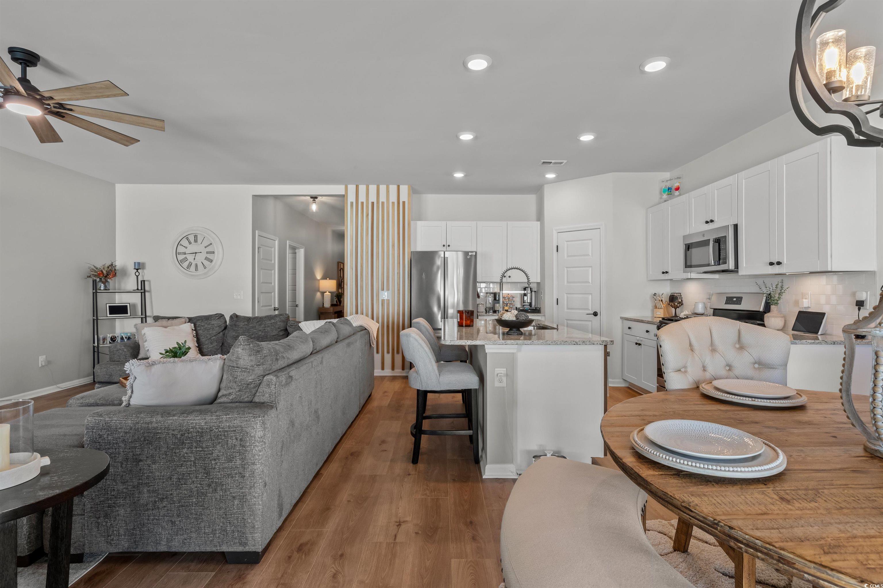 1067 Saltgrass Way Myrtle Beach, SC 29588 - Photo 20 of 40 Dining space with light wood finished floors and recessed lighting