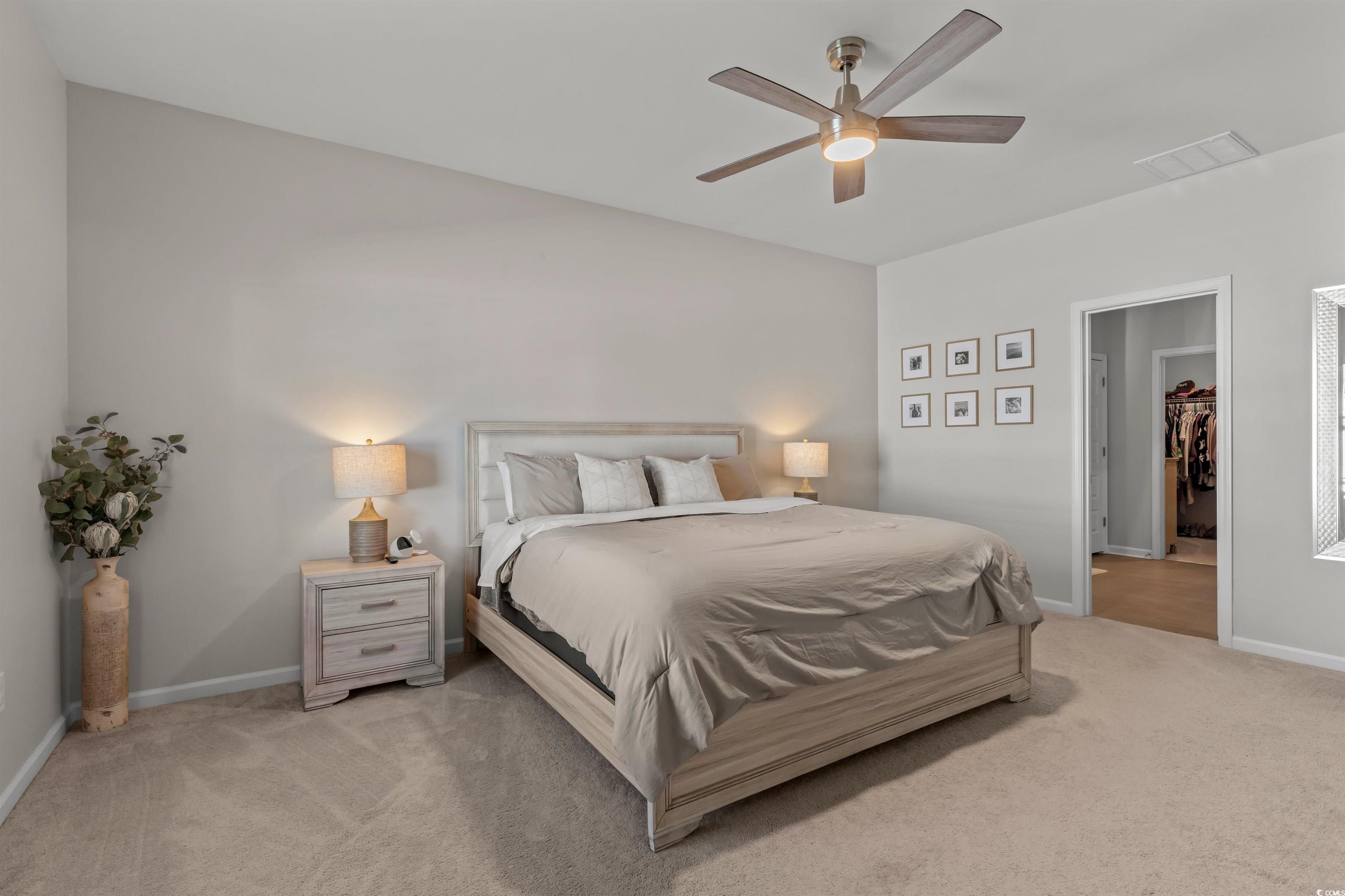 1067 Saltgrass Way Myrtle Beach, SC 29588 - Photo 28 of 40 Bedroom with light carpet and a ceiling fan