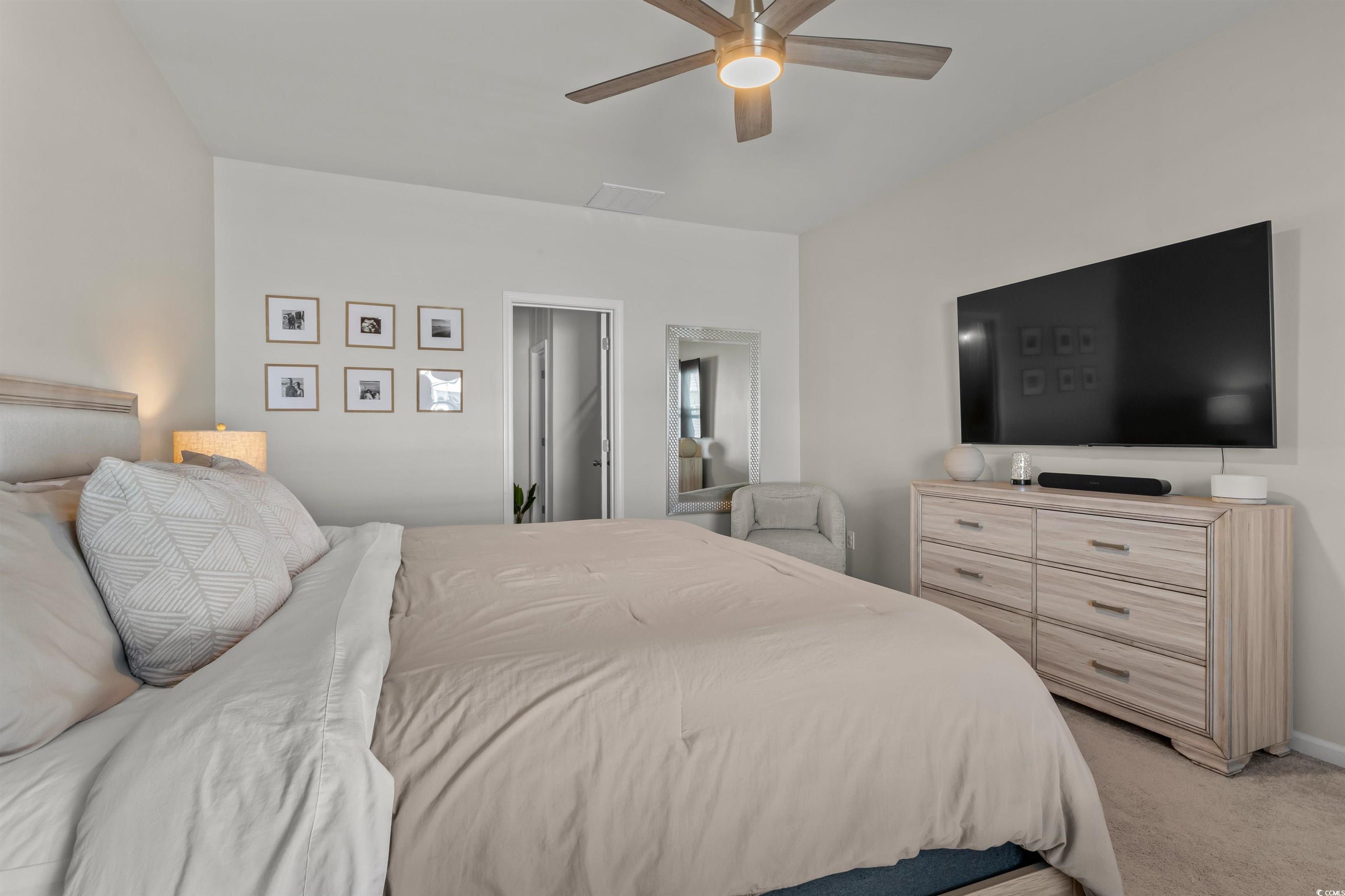 1067 Saltgrass Way Myrtle Beach, SC 29588 - Photo 29 of 40 Bedroom featuring light colored carpet and ceiling fan