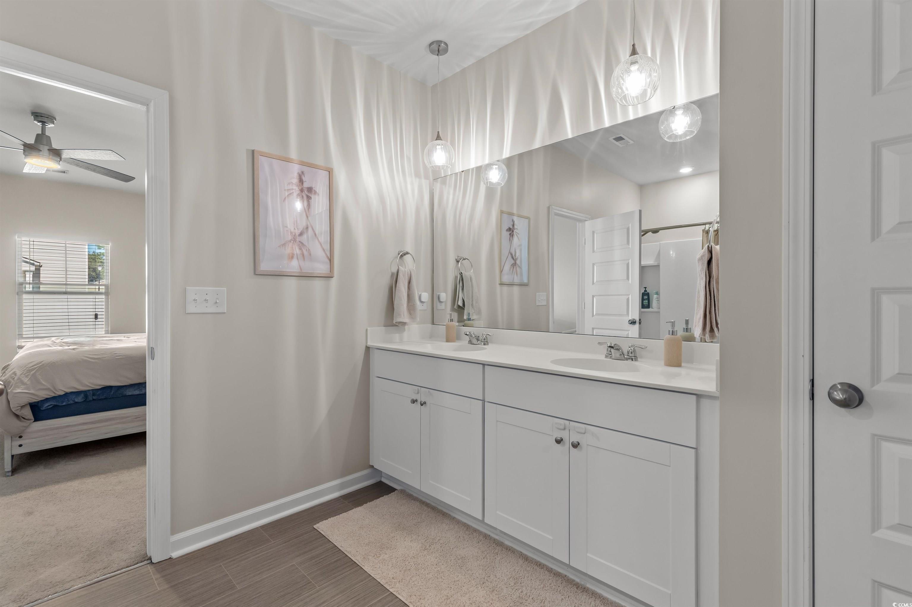 1067 Saltgrass Way Myrtle Beach, SC 29588 - Photo 34 of 40 Bathroom with double vanity, ensuite bath, a shower, and ceiling fan