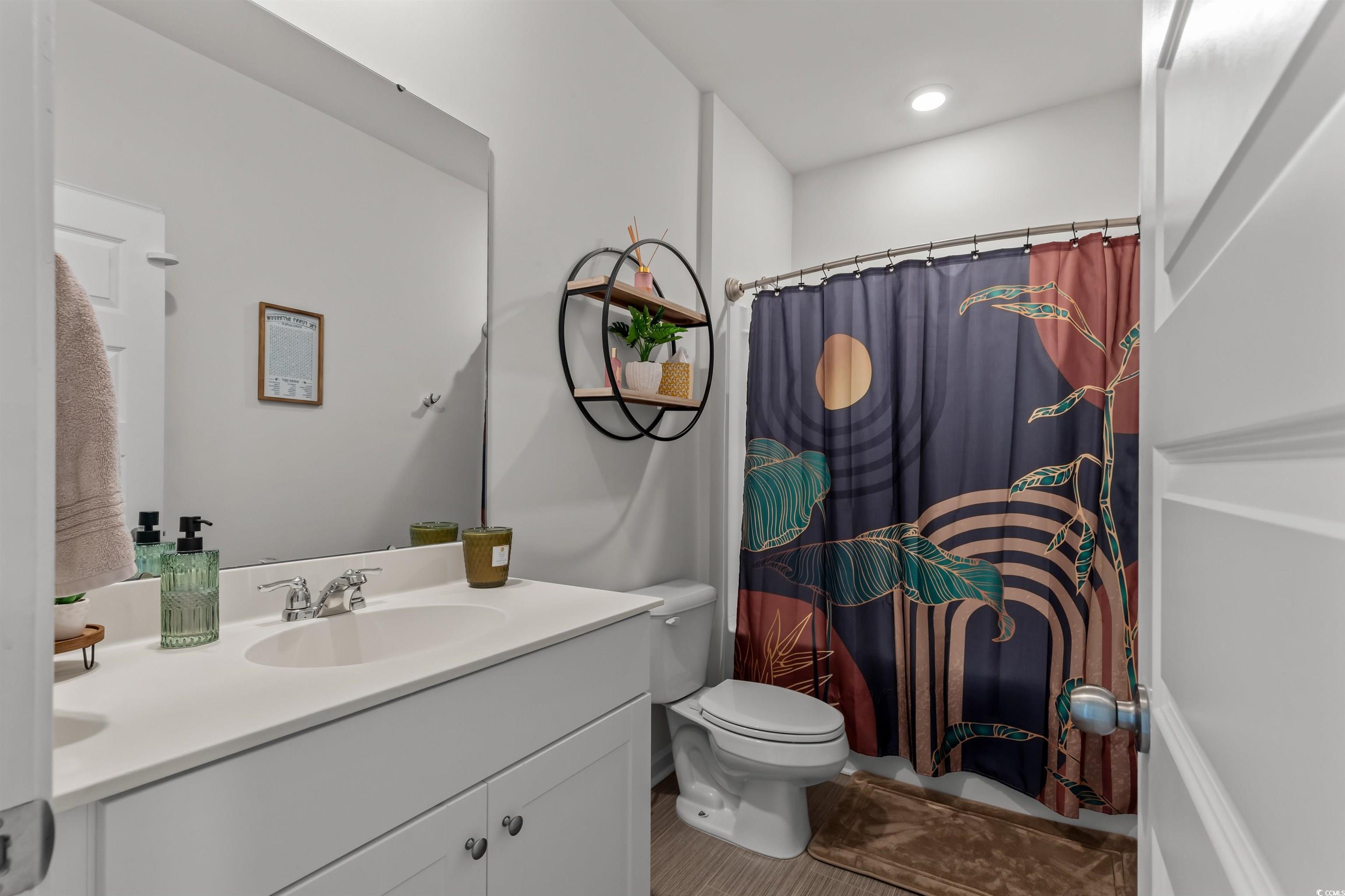 1067 Saltgrass Way Myrtle Beach, SC 29588 - Photo 7 of 40 Bathroom featuring curtained shower and vanity