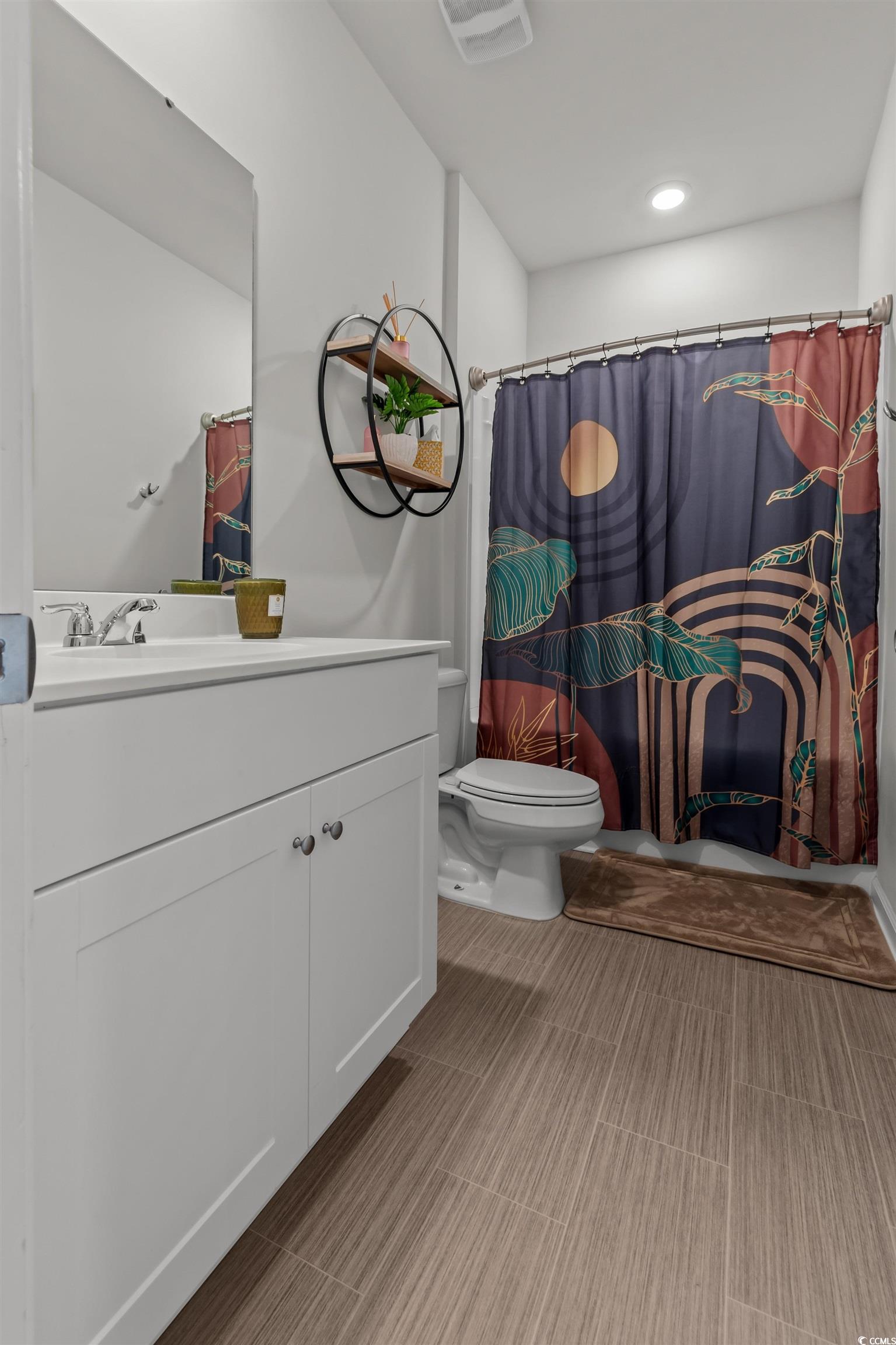 1067 Saltgrass Way Myrtle Beach, SC 29588 - Photo 8 of 40 Full bathroom featuring a shower with curtain, vanity, and recessed lighting