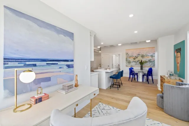 a bedroom with a bed and a chair