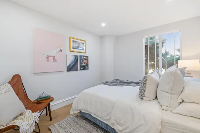 a bedroom with bed and a table