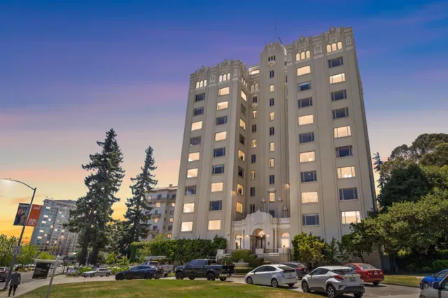 a view of a dining room with furniture and a potted plant