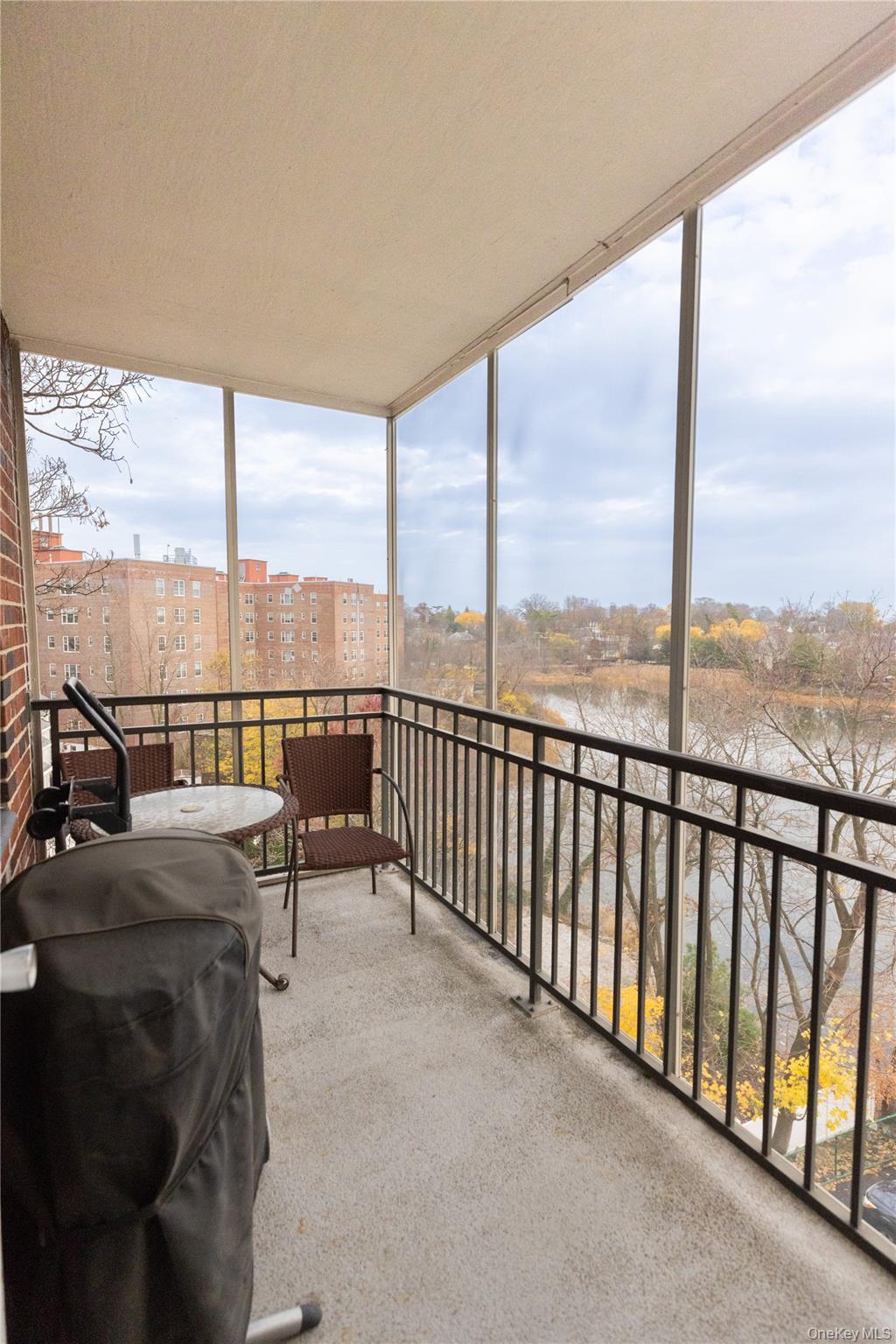 266 Pelham Road, Unit 4H New Rochelle, NY 10805 - Photo 13 of 13 a balcony with furniture and city view