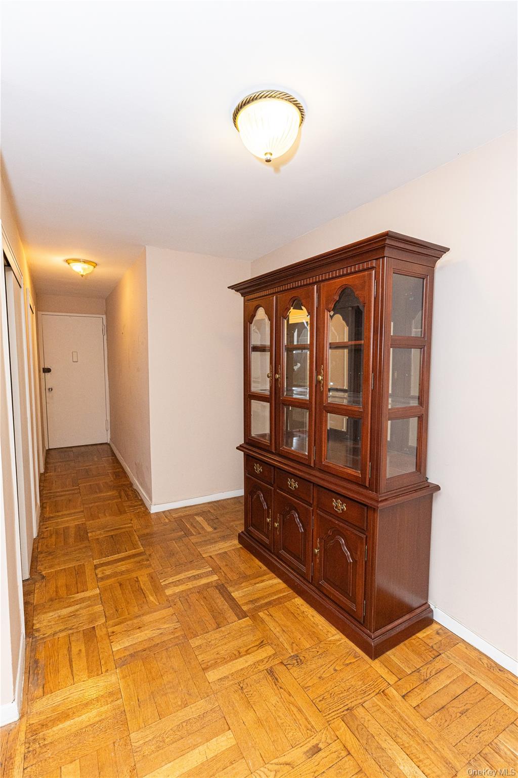 266 Pelham Road, Unit 4H New Rochelle, NY 10805 - Photo 4 of 13 a bedroom with a bed and a dresser