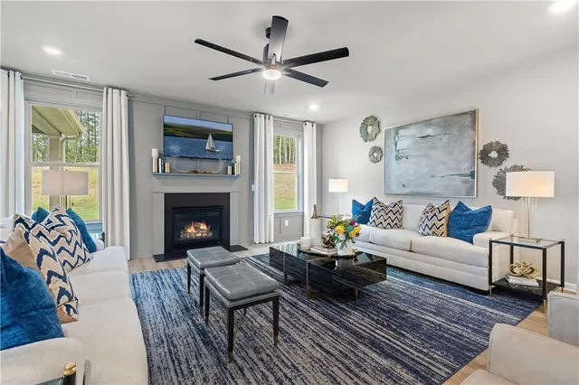 a living room with furniture and a fireplace