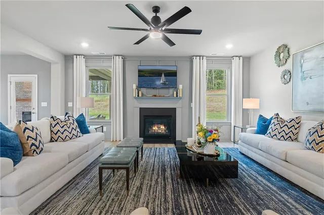 a living room with furniture and a fireplace