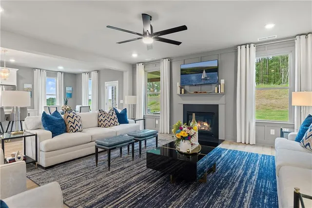 a living room with furniture and a fireplace