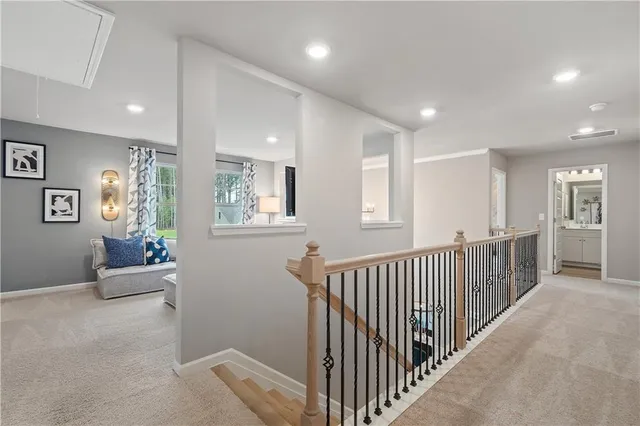 a view of a livingroom with furniture and windows