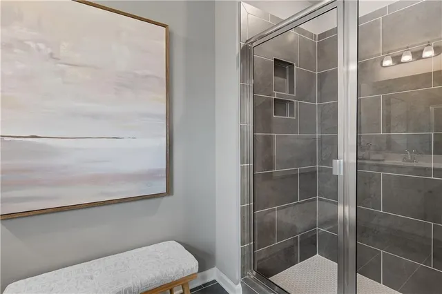 a bathroom with a toilet and a shower