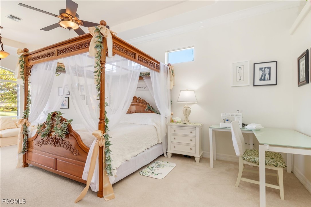 11768 Lady Anne Circle Cape Coral, FL 33991 - Photo 20 of 49 a bedroom with a bed and a table chair