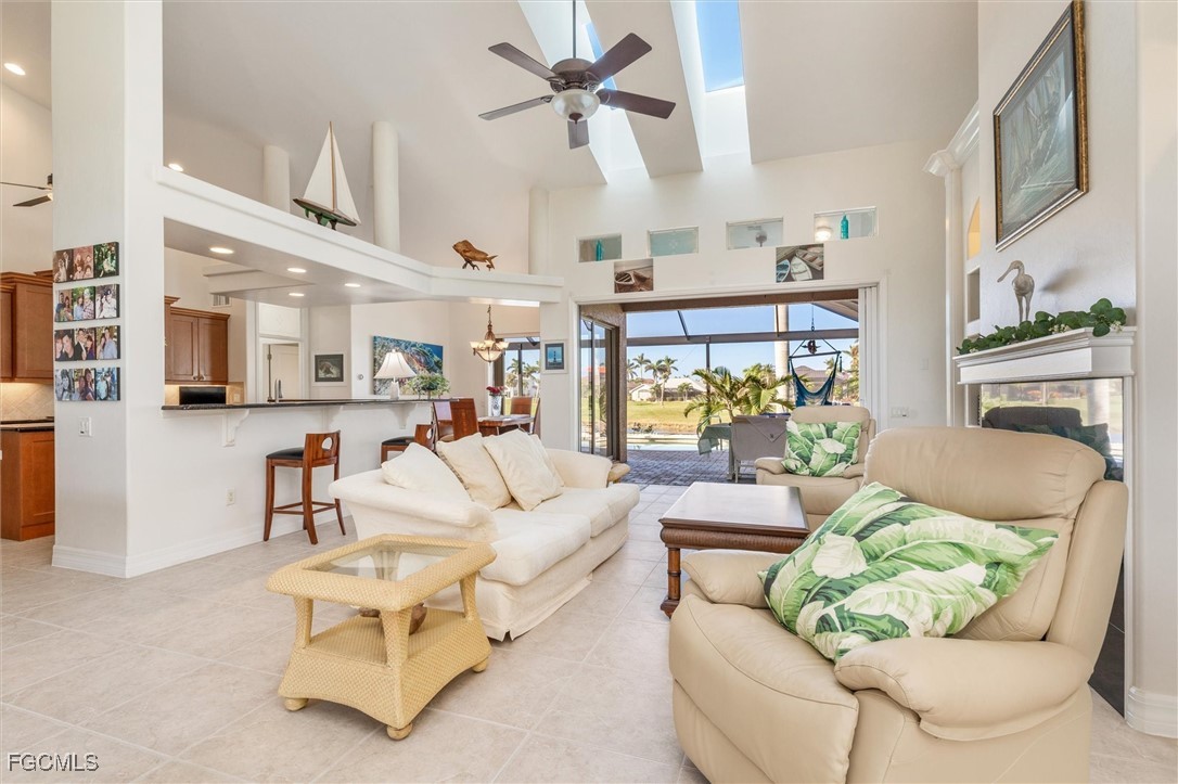 11768 Lady Anne Circle Cape Coral, FL 33991 - Photo 4 of 49 a living room with furniture and a fireplace
