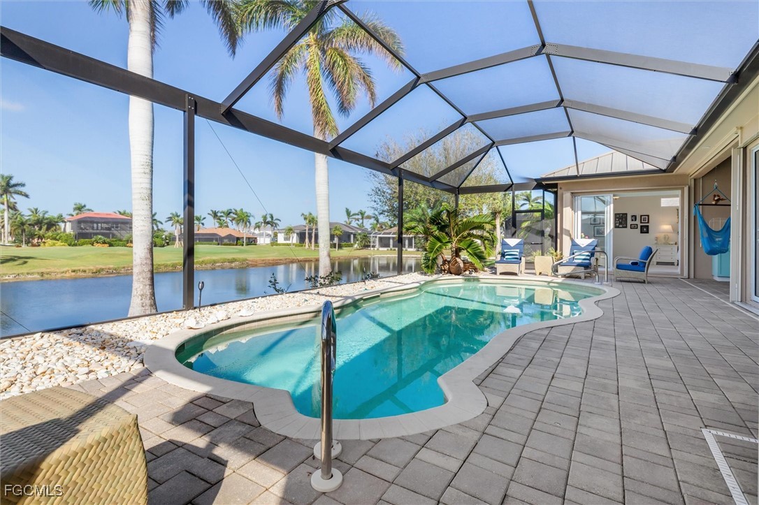 11768 Lady Anne Circle Cape Coral, FL 33991 - Photo 47 of 49 a view of a swimming pool with a porch