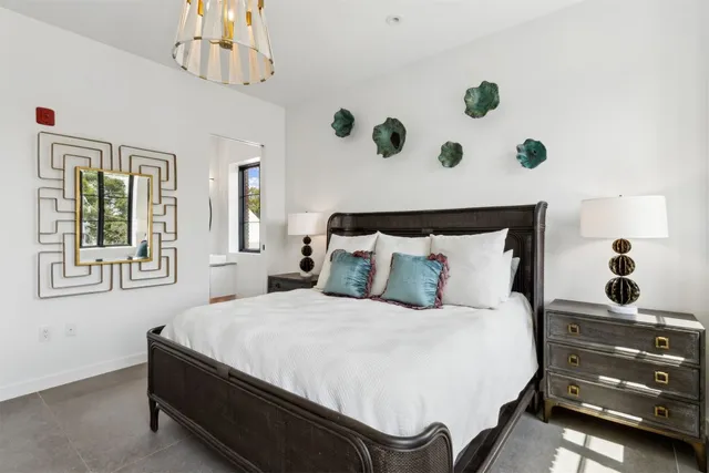 a bedroom with a bed and a couch