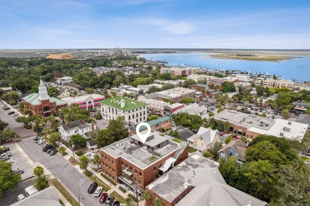 a view of a livingroom with furniture and a flat screen tv