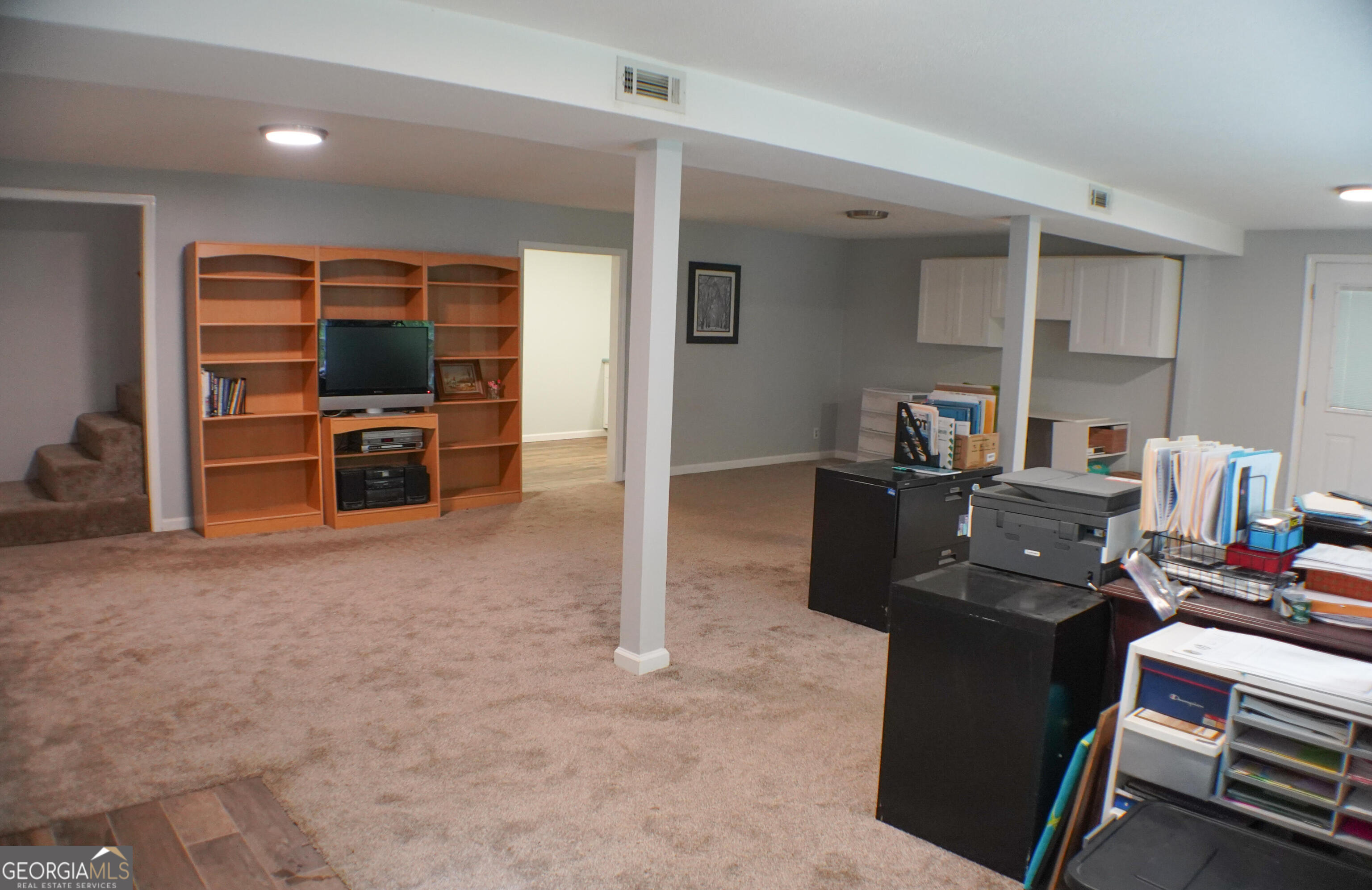 335 Winding Stream Trail Hampton, GA 30228 - Photo 26 of 35 a view of a workspace with furniture