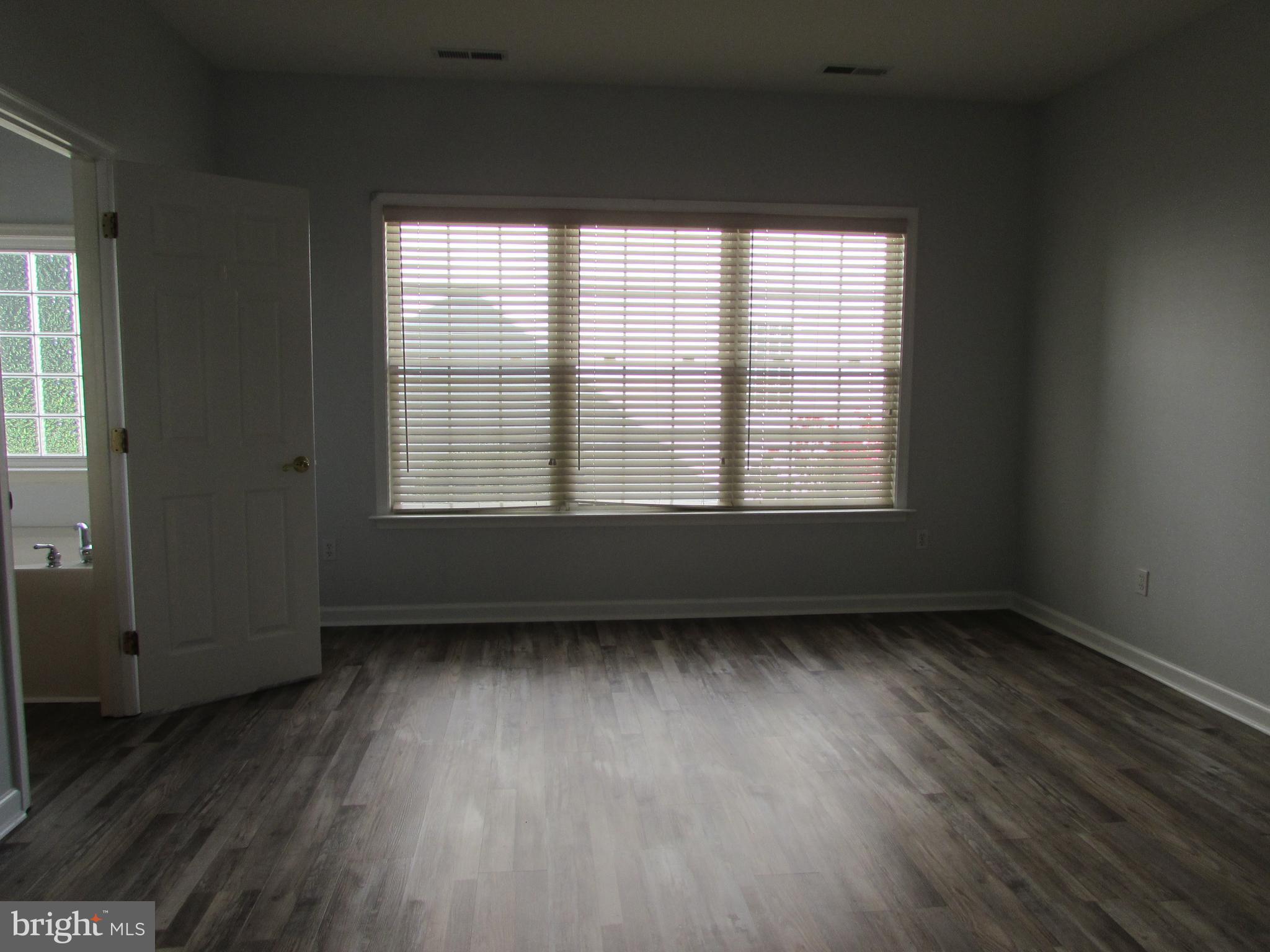 87 Hingham Lane Berlin, MD 21811 - Photo 21 of 39 Primary bedroom large windows