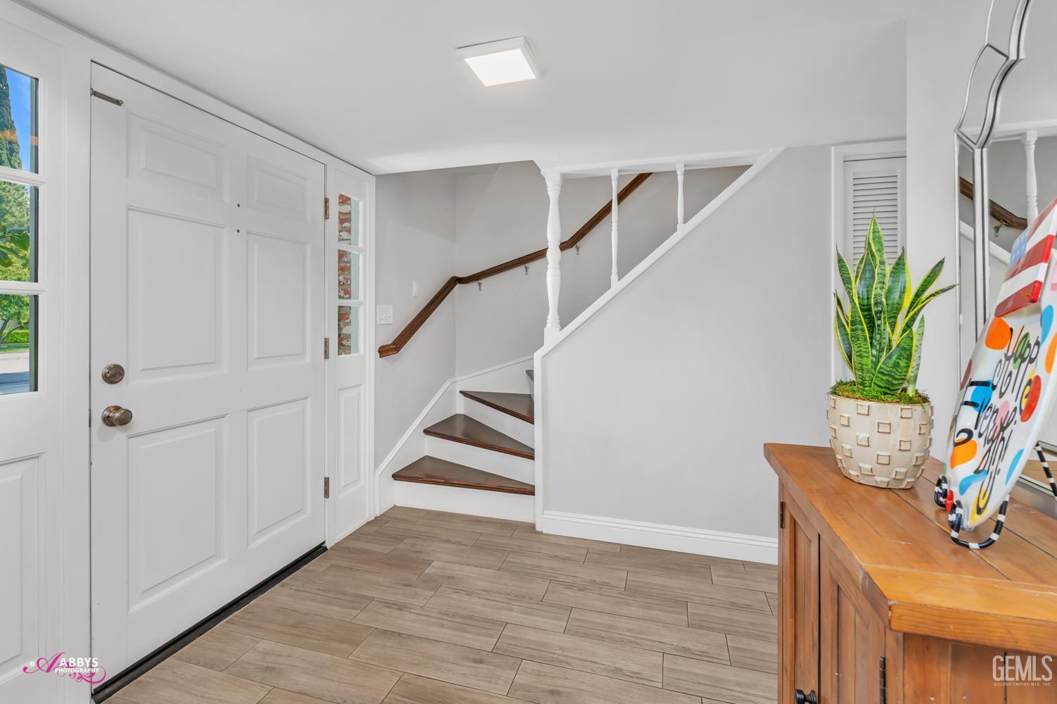 Undisclosed Address Bakersfield, CA 93309 - Photo 16 of 30 a view of entryway with stairs and wooden floor