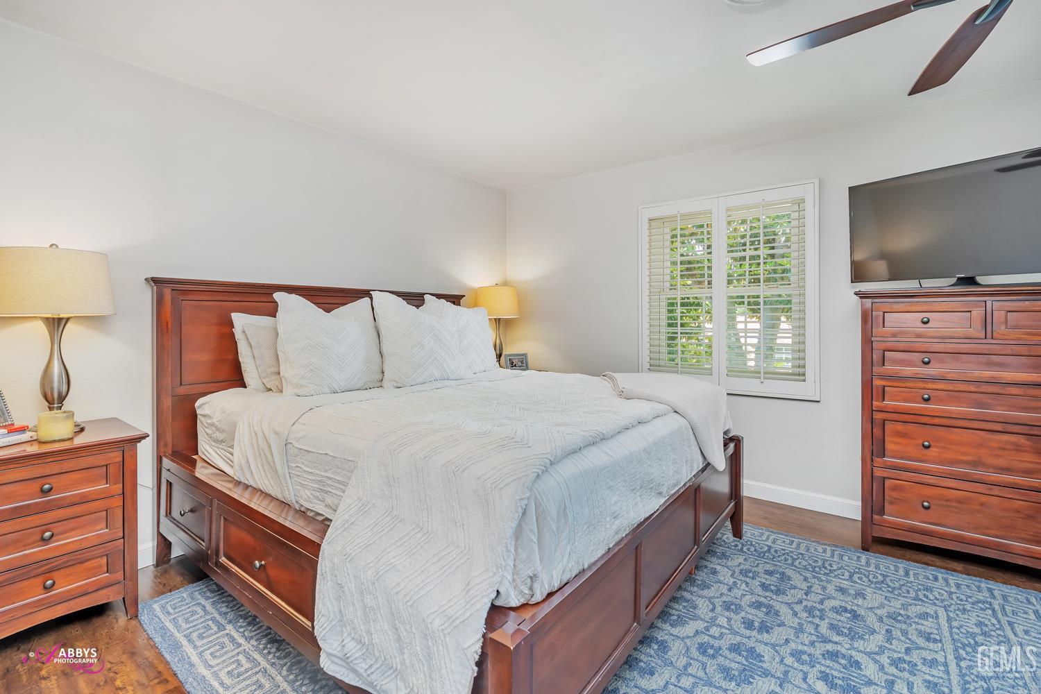 Undisclosed Address Bakersfield, CA 93309 - Photo 20 of 30 a bed room with a bed and a television