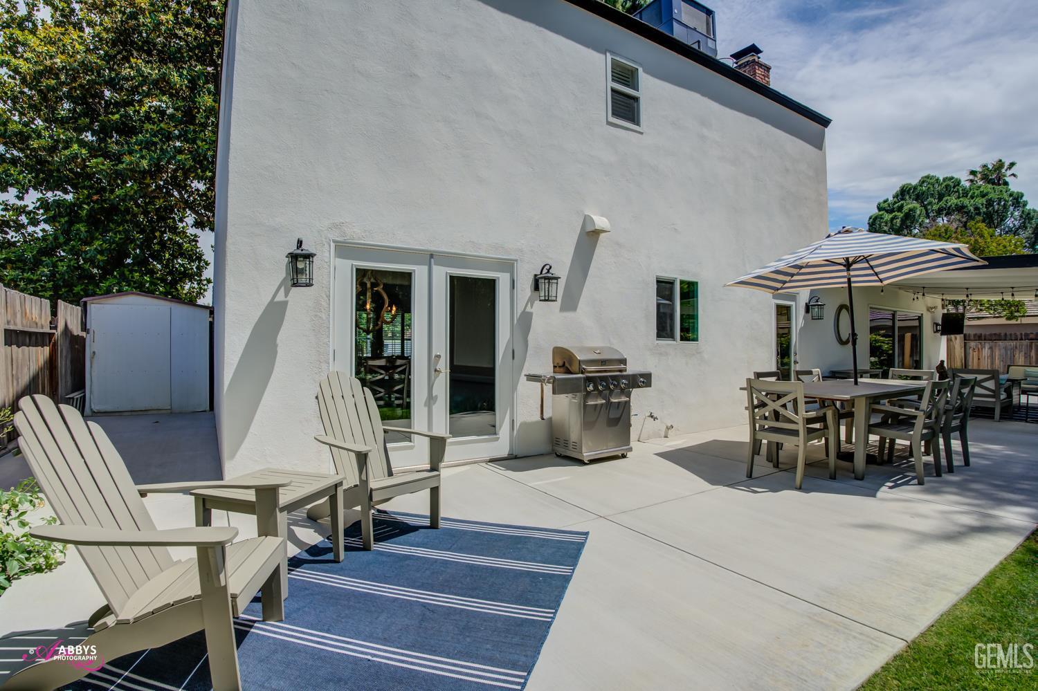 Undisclosed Address Bakersfield, CA 93309 - Photo 27 of 30 an outdoor space with patio the couches and pool table with chairs