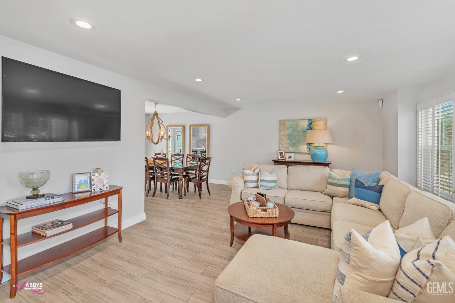 Undisclosed Address Bakersfield, CA 93309 - Photo 3 of 30 a living room with furniture and a flat screen tv